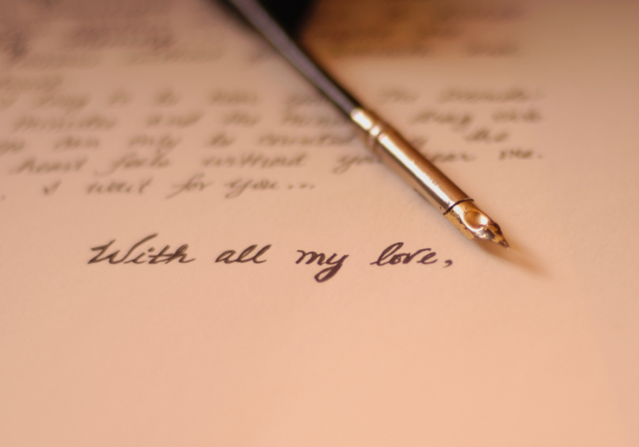 pen and paper with a love letter letter to husband on wedding day 