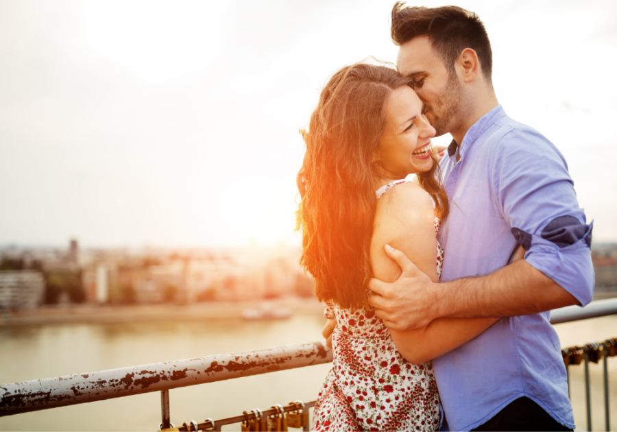 sweet guy kissing his girl by the sunset signs a player is falling in love