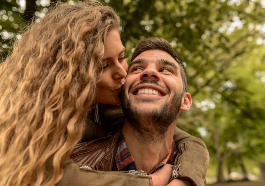 woman kissing man, love letters to make him cry