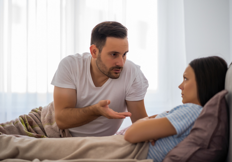 unhappy couple in bed how to know when to leave a relationship